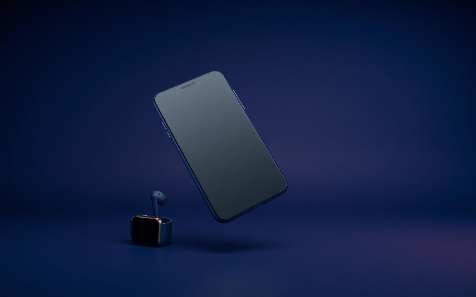 Smartphone, earbuds and smartwatch on a navy backdrop